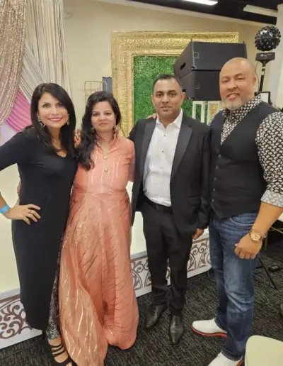 New Day Senior Care representatives standing with guests in formal attire | New Day Lifestyle for Seniors