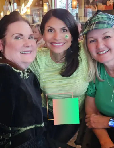 Senior care advisor enjoying a St. Patrick's Day event with colleagues | New Day Lifestyle for Seniors