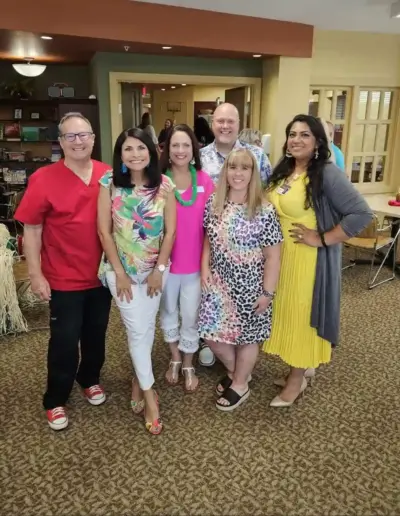 Senior care advisors and healthcare partners inside a community room | New Day Lifestyle for Seniors