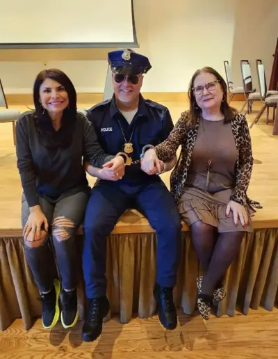 Senior care advisors with a colleague in a police costume | New Day Lifestyle for Seniors