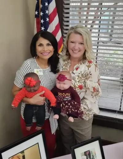 Senior placement advisor with a colleague and doll therapy figures | New Day Lifestyle for Seniors