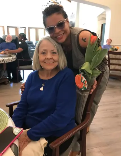 Senior placement specialist with an elderly resident at an assisted living facility | New Day Lifestyle for Seniors